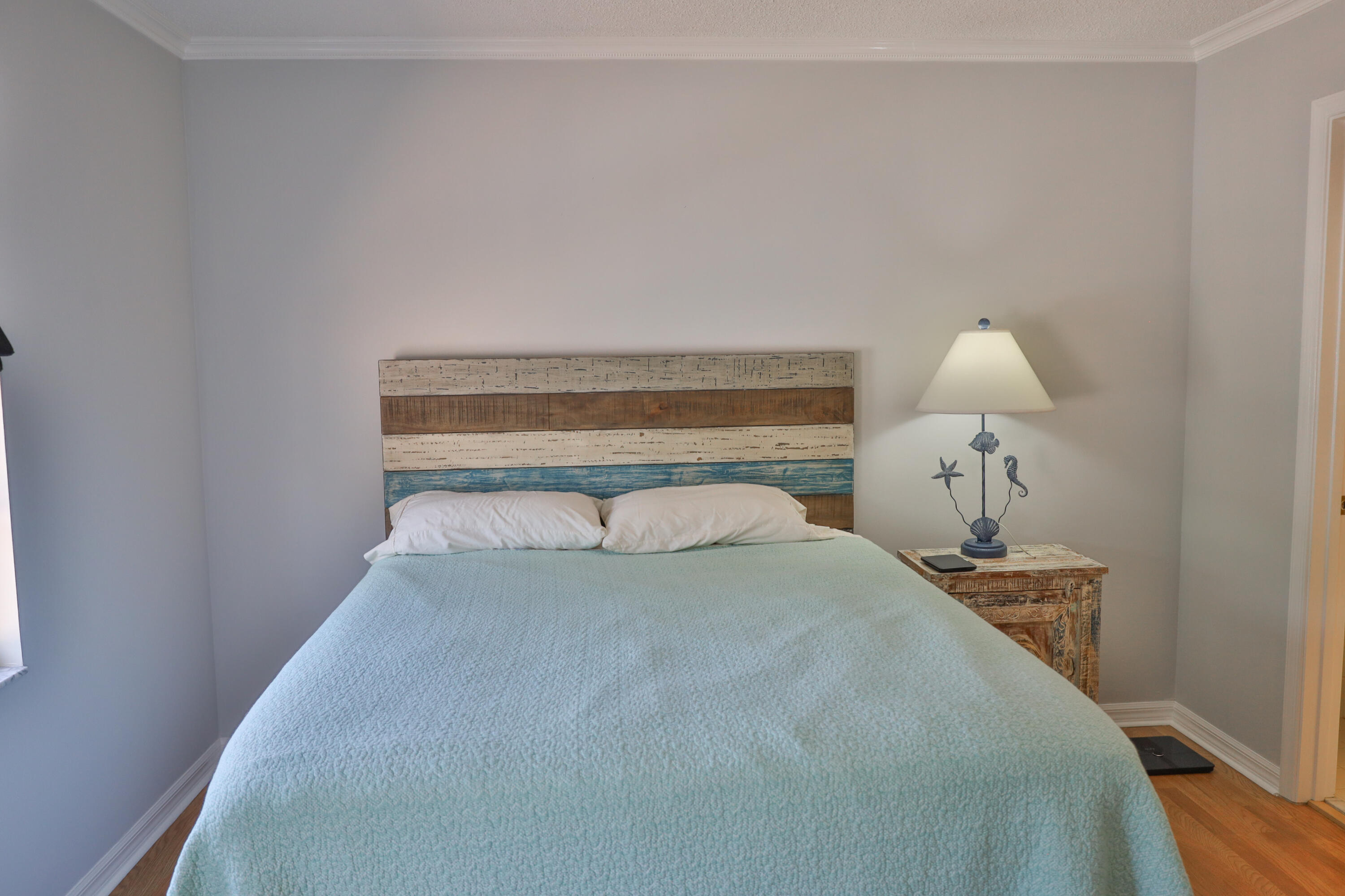 334 Timberwalk Trail Jupiter, FL 33458 - Photo 18 of 51 a bedroom with a bed and a lamp