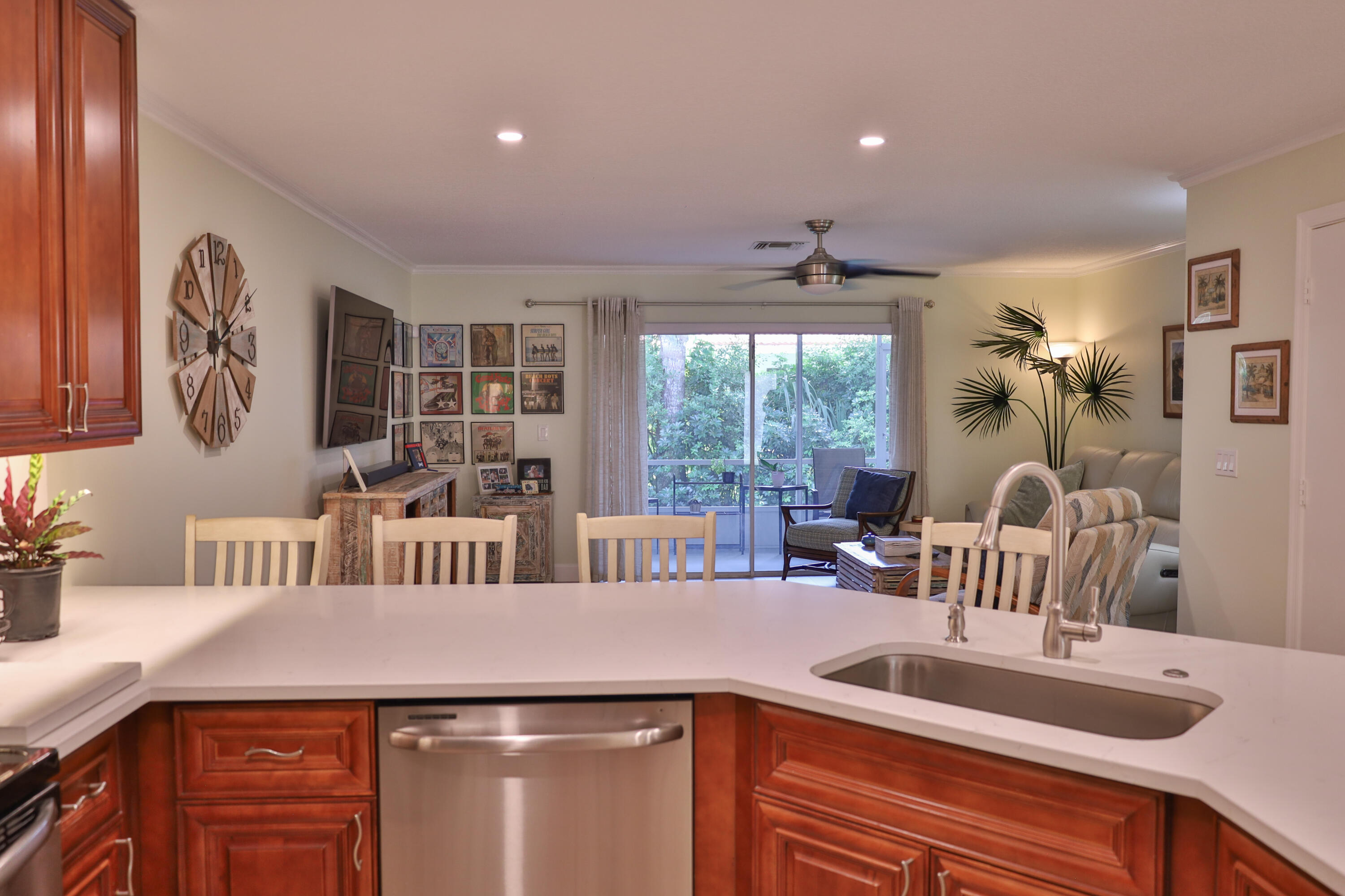 334 Timberwalk Trail Jupiter, FL 33458 - Photo 3 of 51 a kitchen with stainless steel appliances granite countertop a sink and a refrigerator