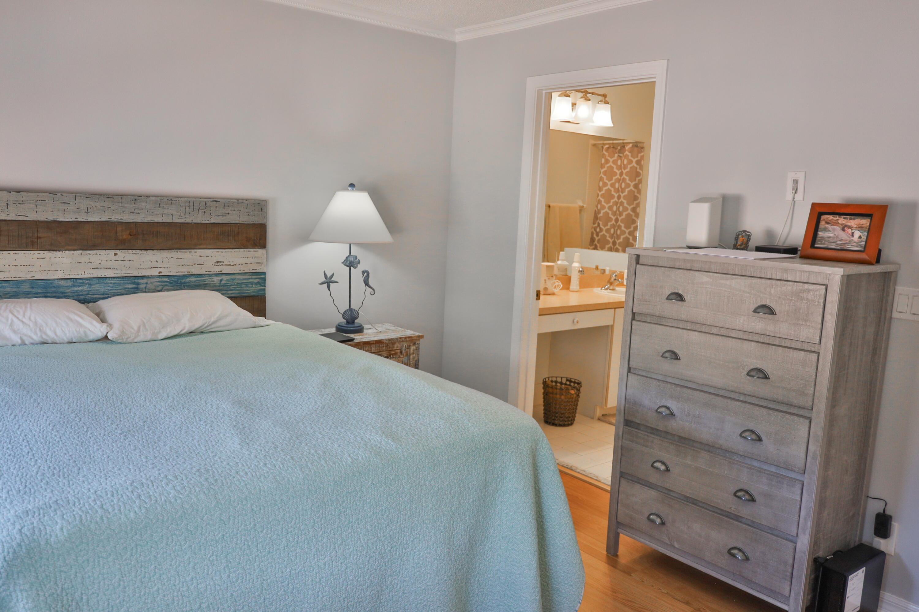 334 Timberwalk Trail Jupiter, FL 33458 - Photo 5 of 51 a bedroom with a bed and a dresser