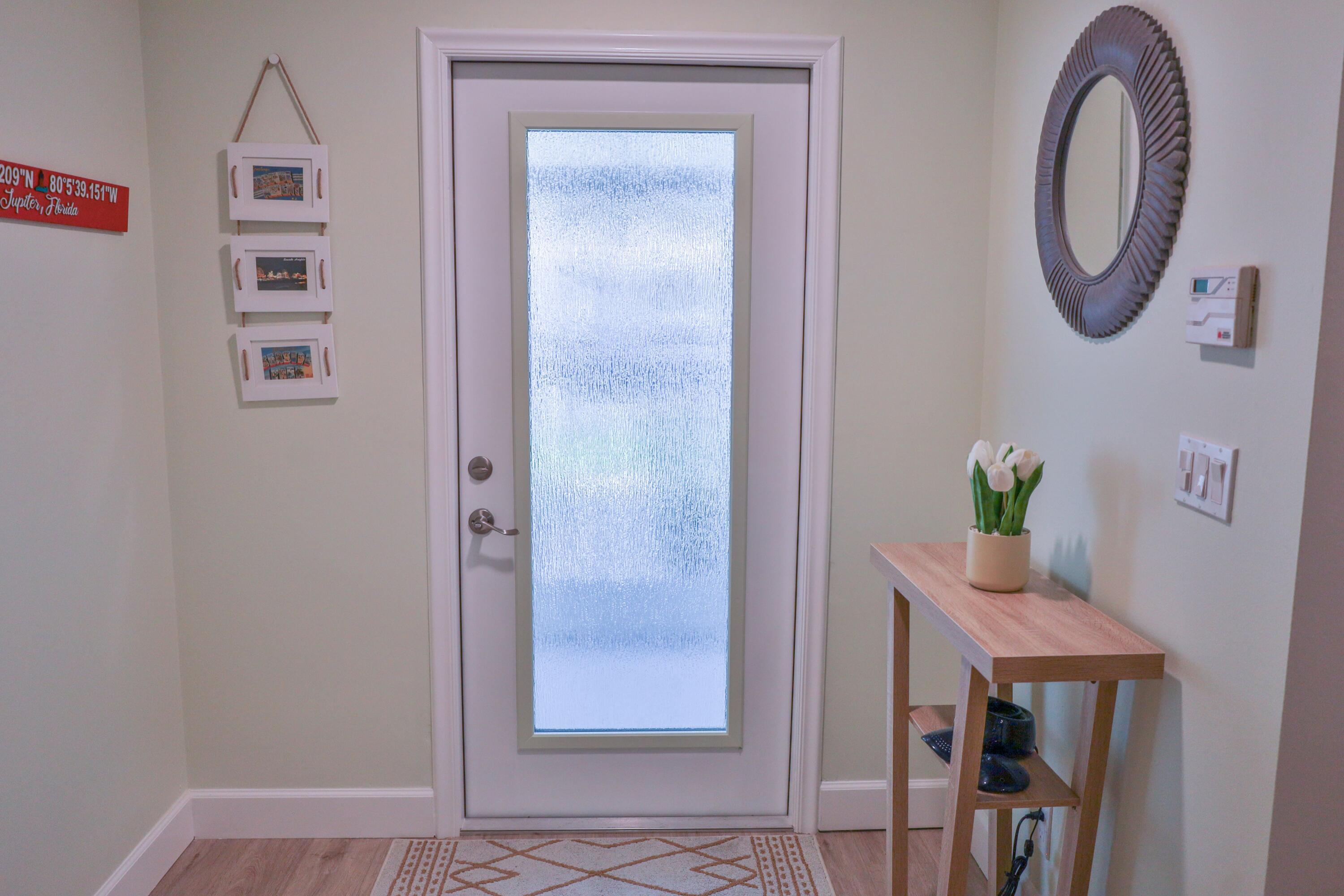 334 Timberwalk Trail Jupiter, FL 33458 - Photo 6 of 51 a view of a hallway with entryway
