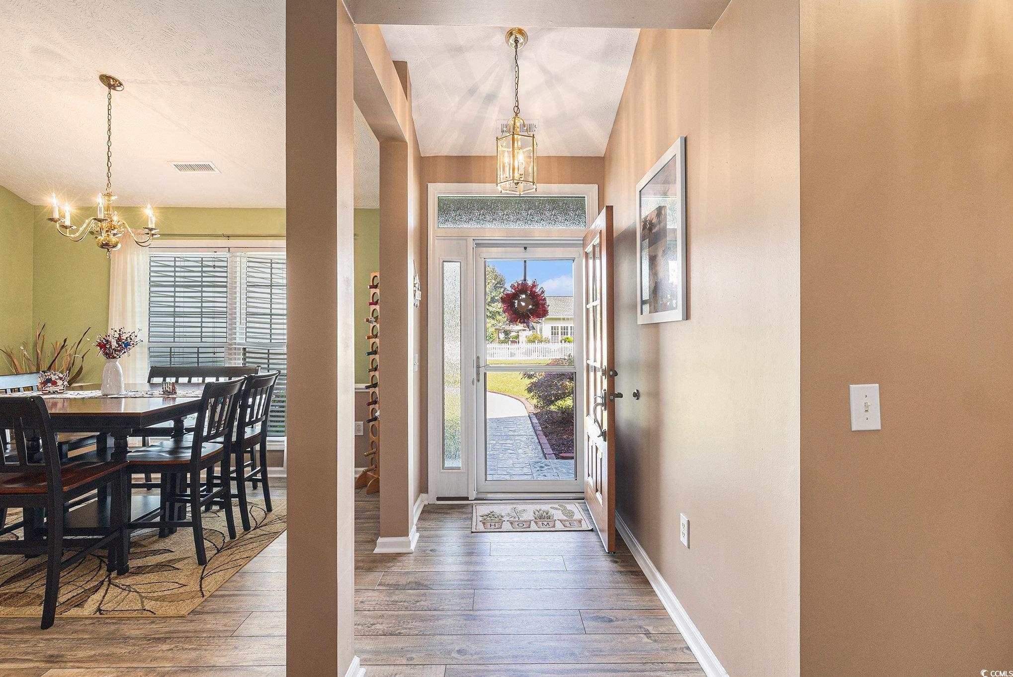 1105 Lampwick Lane Murrells Inlet, SC 29576 - Photo 9 of 40 Entrance foyer featuring a chandelier, baseboards, and healthy amount of natural light