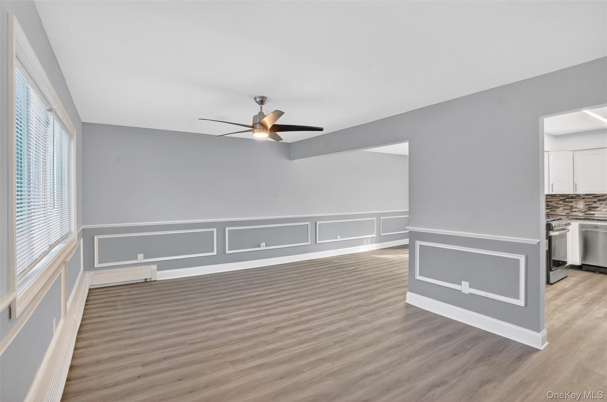 15 North Aspen Road Middletown, NY 10940 - Photo 4 of 16 a view of an empty room with wooden floor and a window