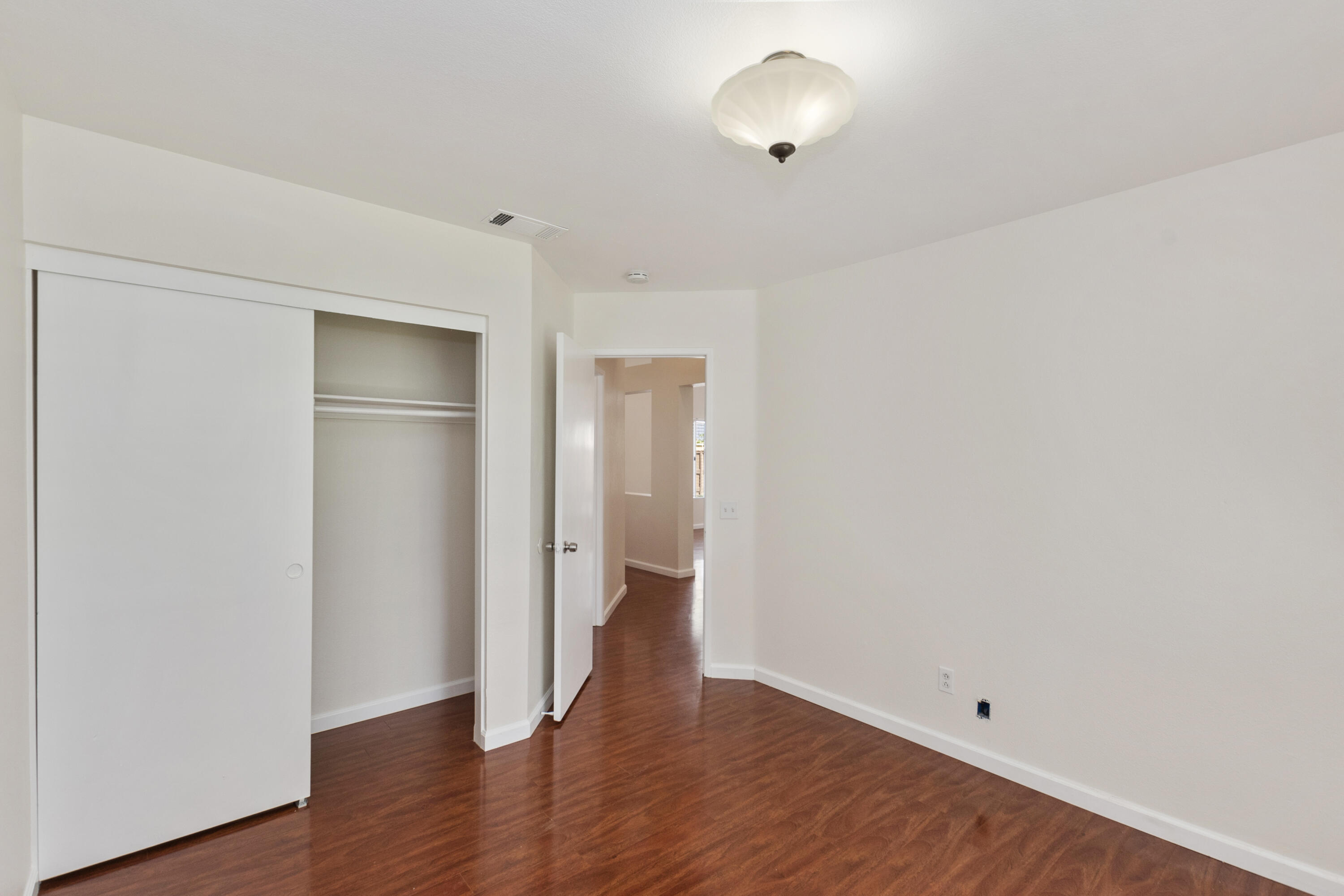 80472 Suncastle Road Indio, CA 92201 - Photo 18 of 32 a view of an empty room with wooden floor