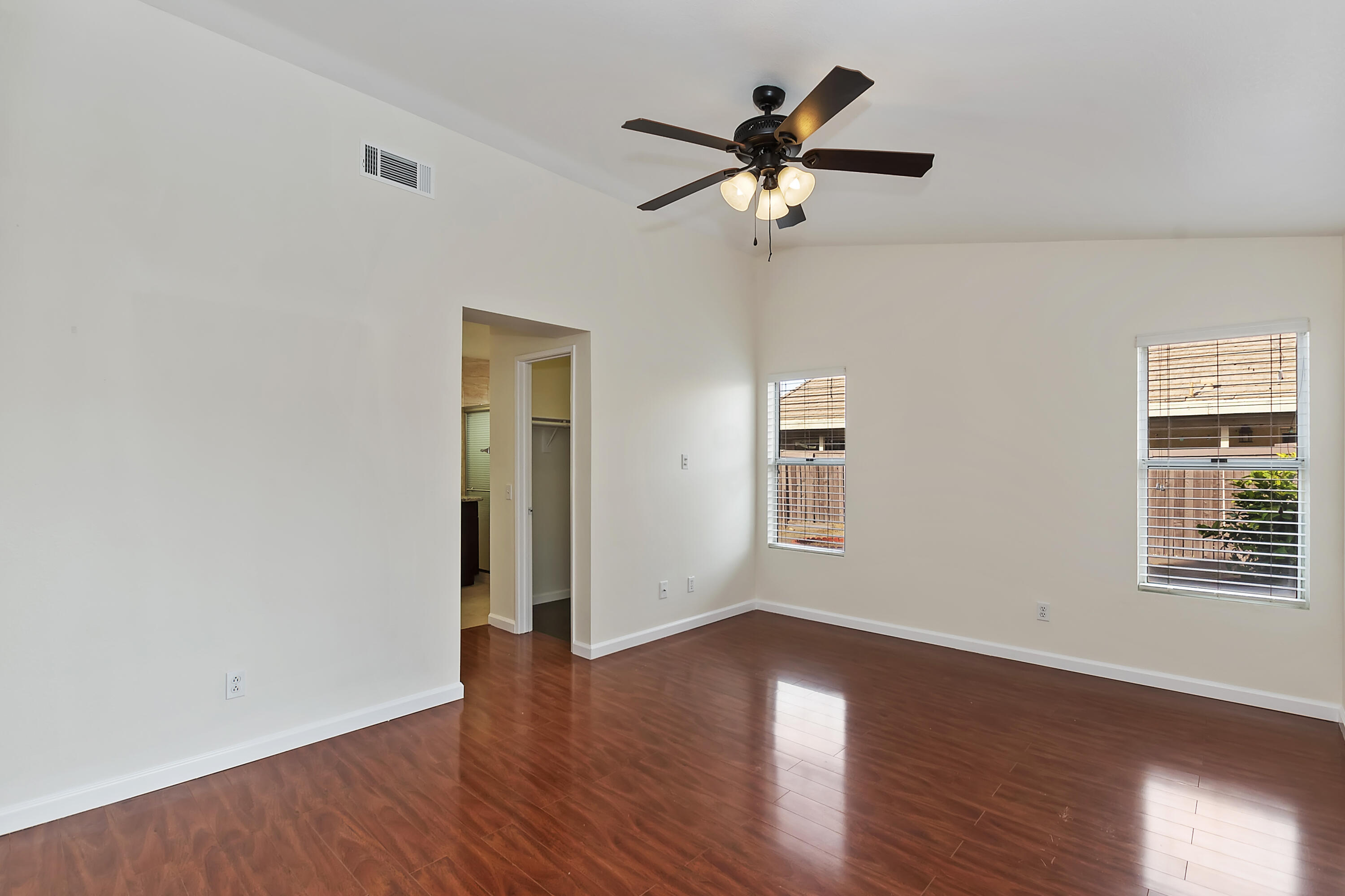 80472 Suncastle Road Indio, CA 92201 - Photo 25 of 32 a view of empty room with wooden floor and fan