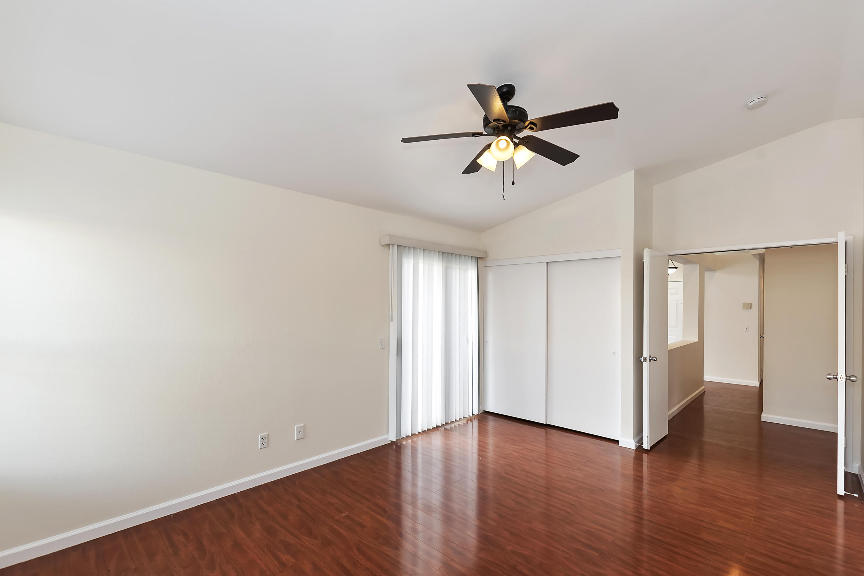 80472 Suncastle Road Indio, CA 92201 - Photo 26 of 32 an empty room with wooden floor closet and windows