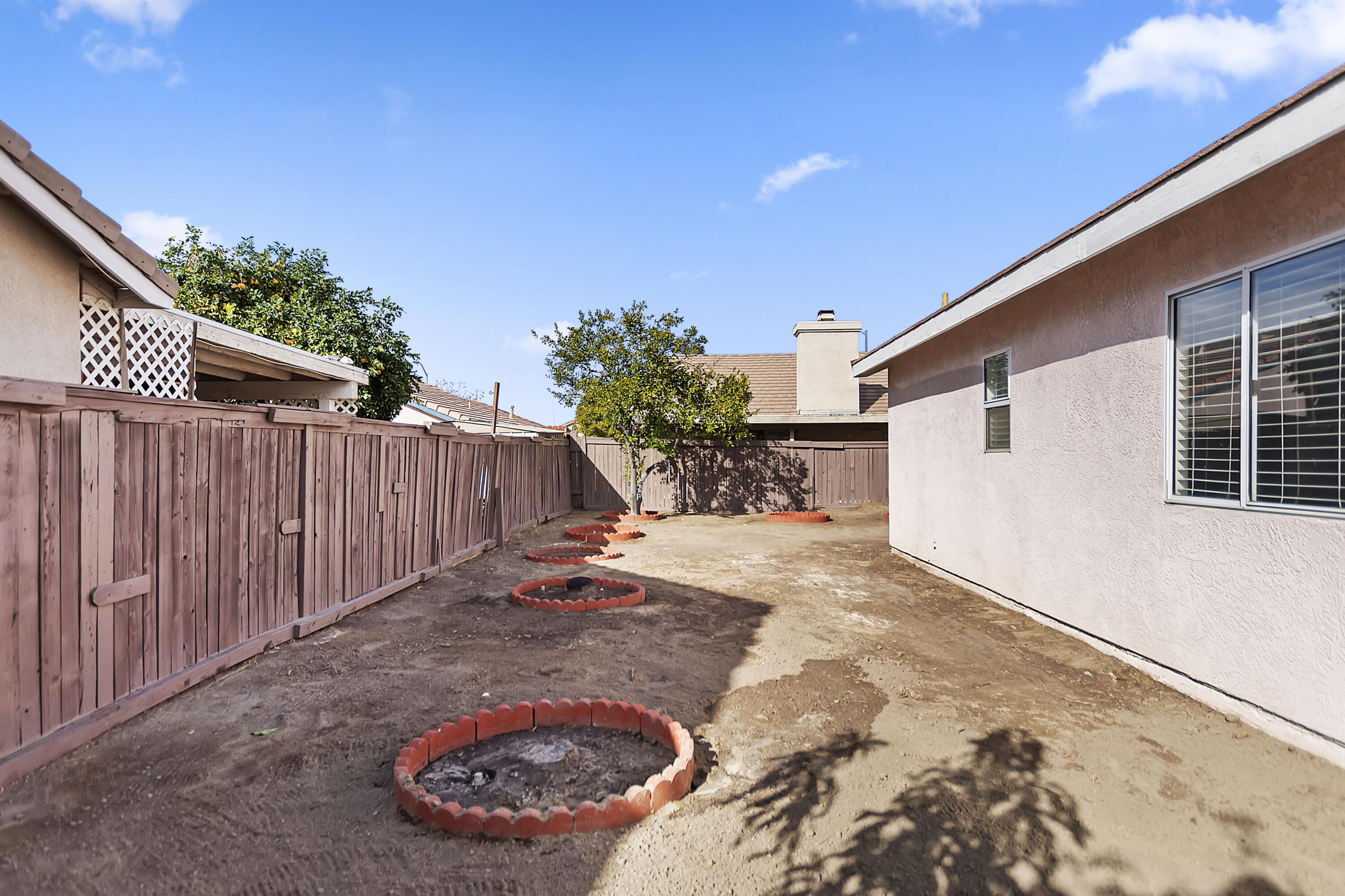 80472 Suncastle Road Indio, CA 92201 - Photo 32 of 32 a view of a backyard with wooden fence