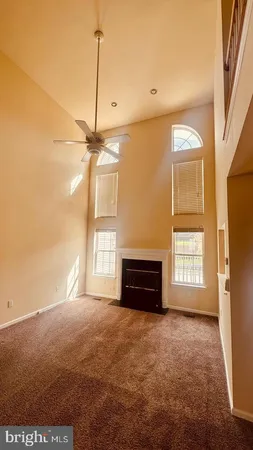 a view of a livingroom with furniture window and wooden floor