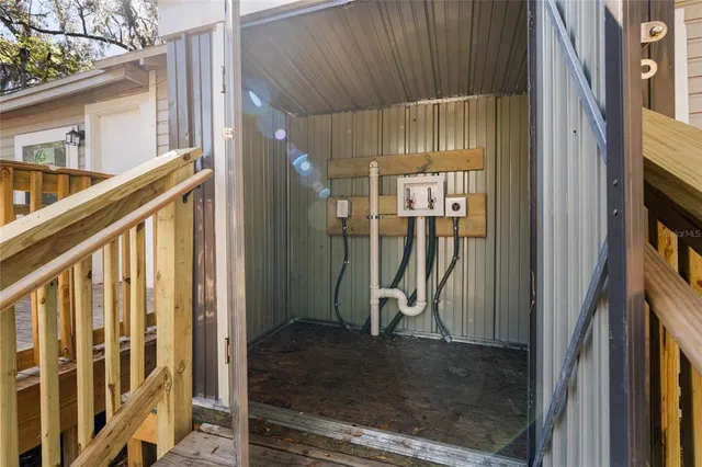 a view of a porch with wooden floor and stairs