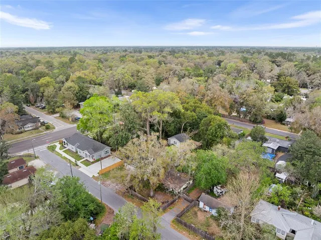 an aerial view of residential house with outdoor space