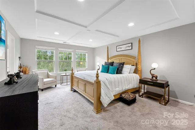 a bedroom with a bed and a lamp with window