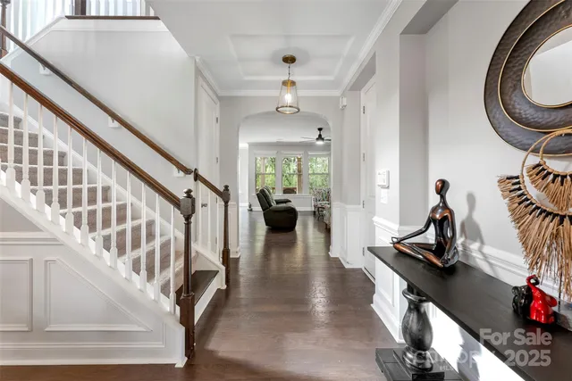 a view of a livingroom with furniture and a ceiling fan