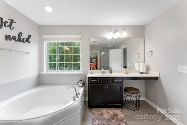 a bathroom with a bathtub and a sink