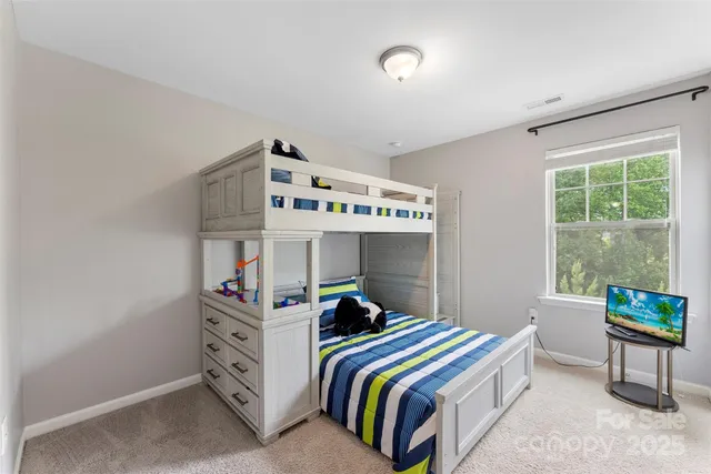 a bedroom with bed and a window