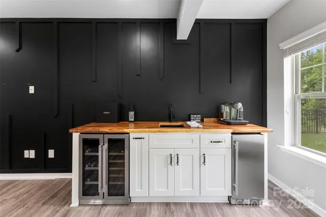 a kitchen with a stove and a wooden cabinets
