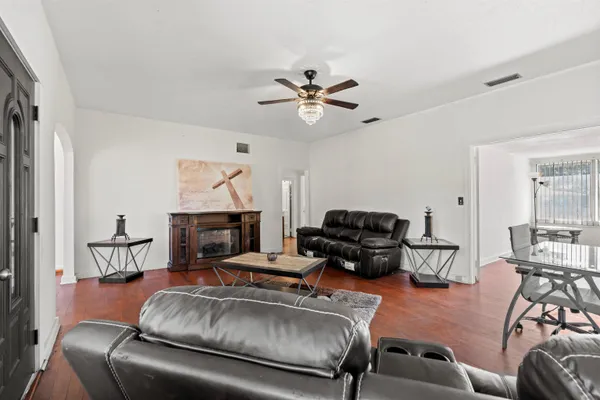 a living room with furniture and a fireplace