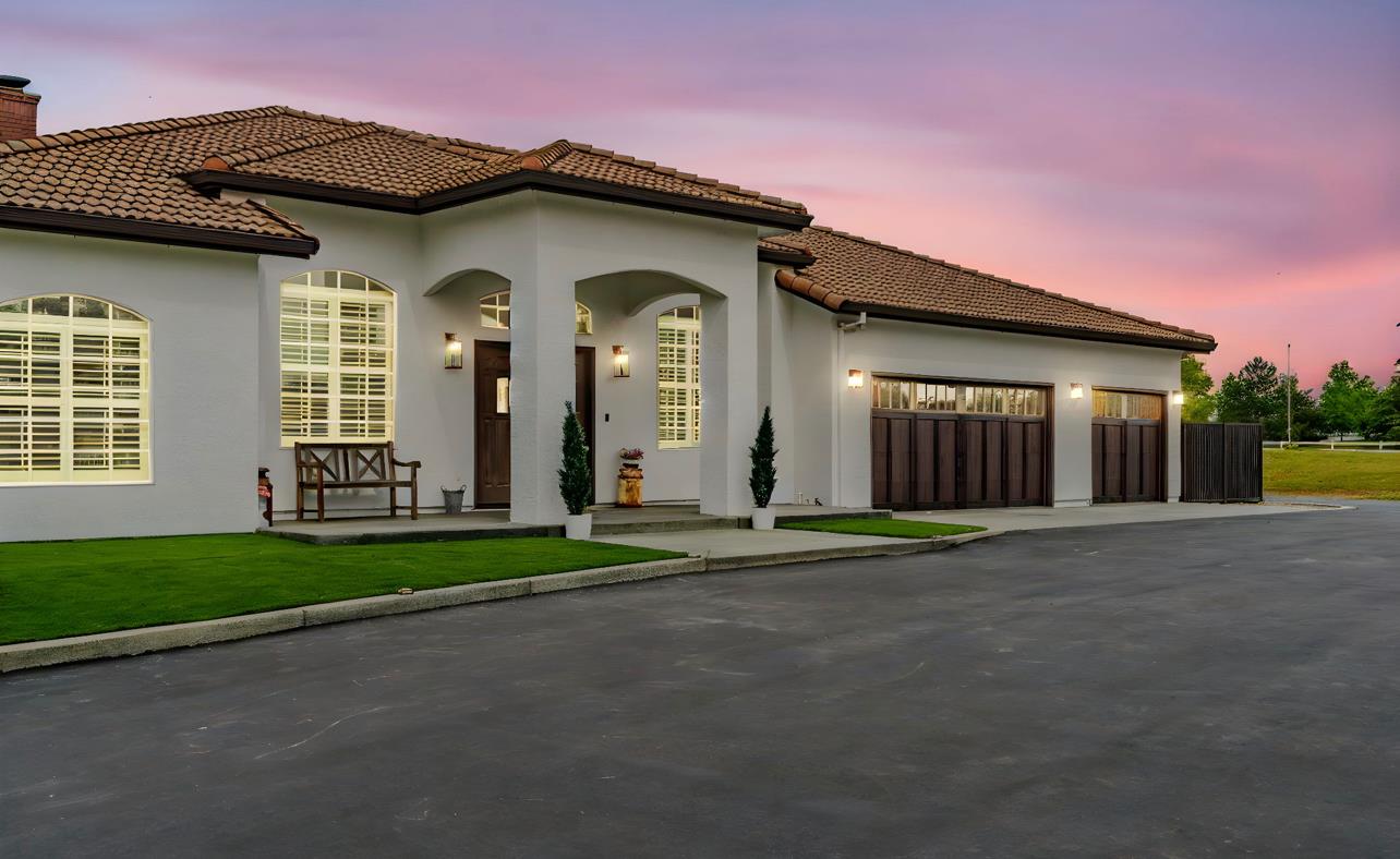 5600 Ferseyna Way Valley Springs, CA 95252 - Photo 14 of 94 a front view of a house with a yard and garage