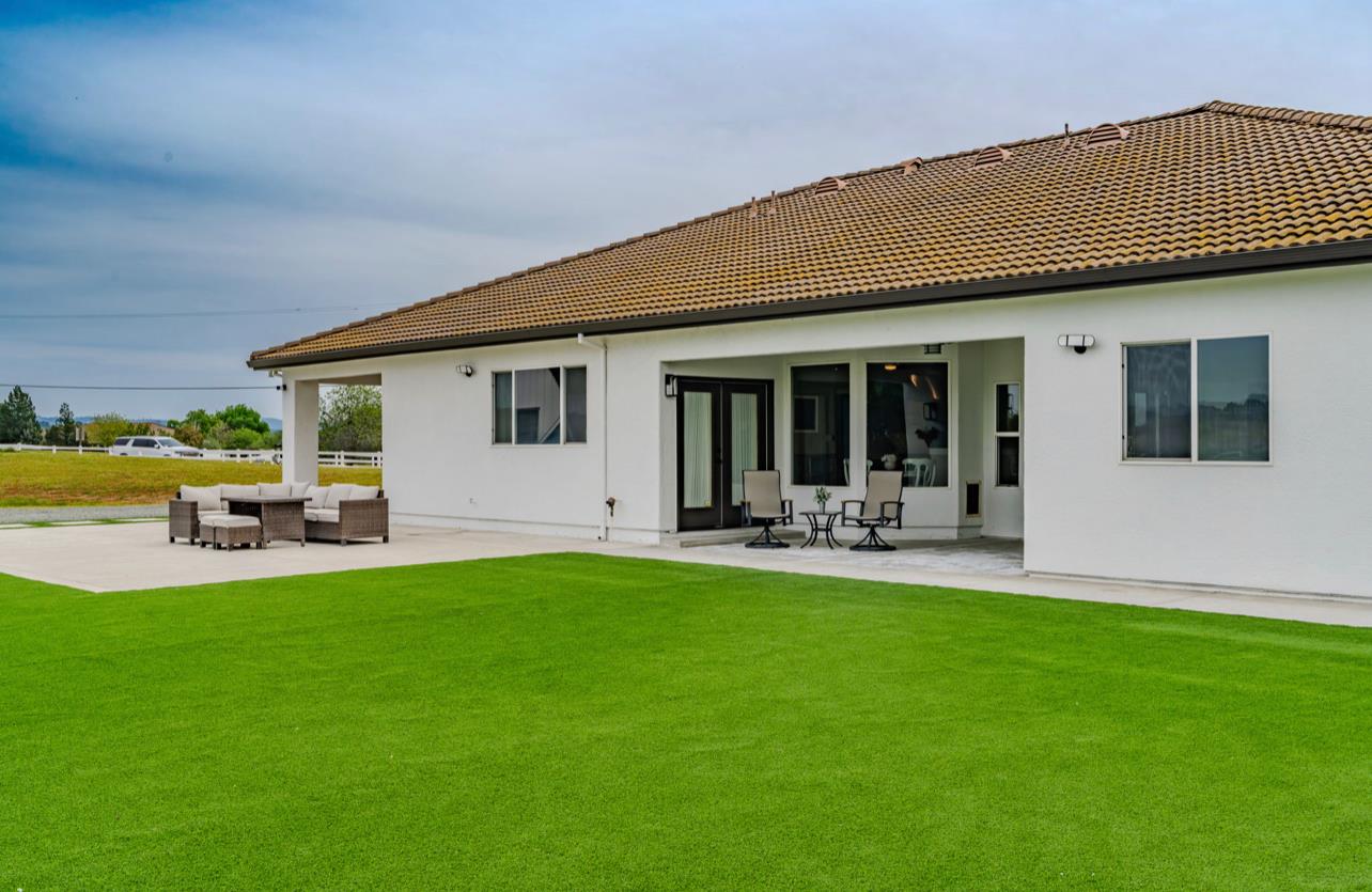 5600 Ferseyna Way Valley Springs, CA 95252 - Photo 33 of 94 a view of a house with backyard porch and sitting area