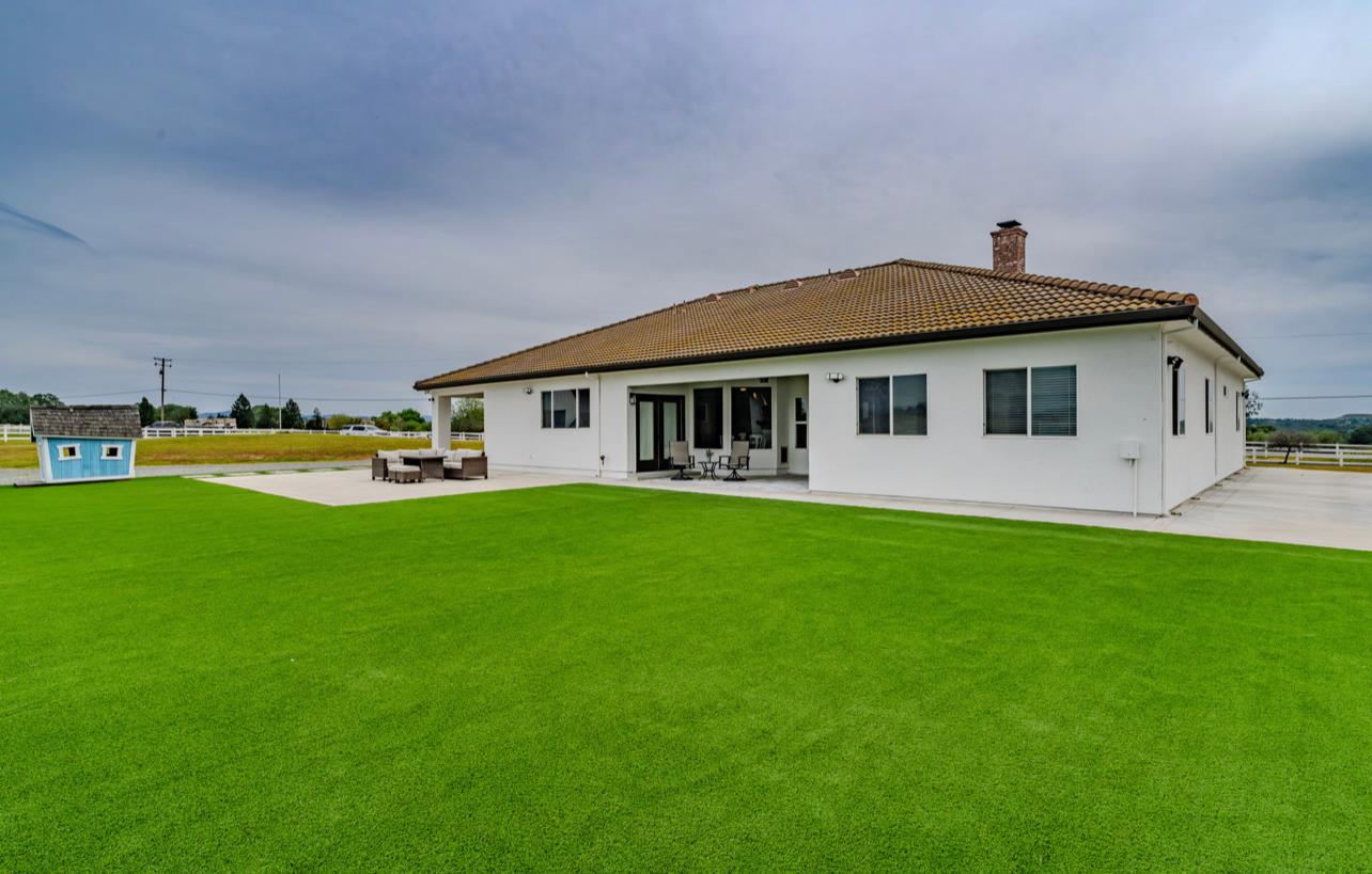 5600 Ferseyna Way Valley Springs, CA 95252 - Photo 34 of 94 a front view of house with yard and outdoor seating