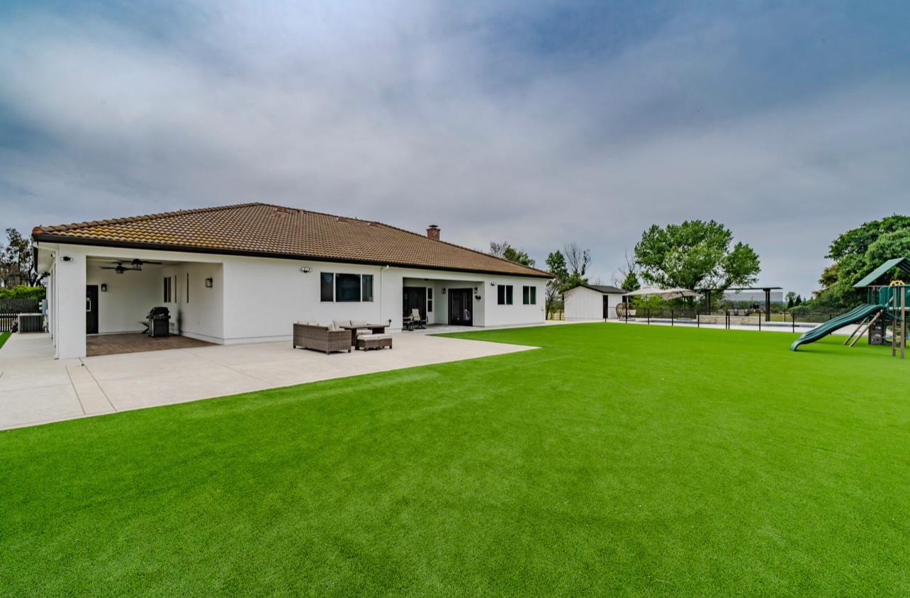 5600 Ferseyna Way Valley Springs, CA 95252 - Photo 37 of 94 a front view of a house with a garden and porch