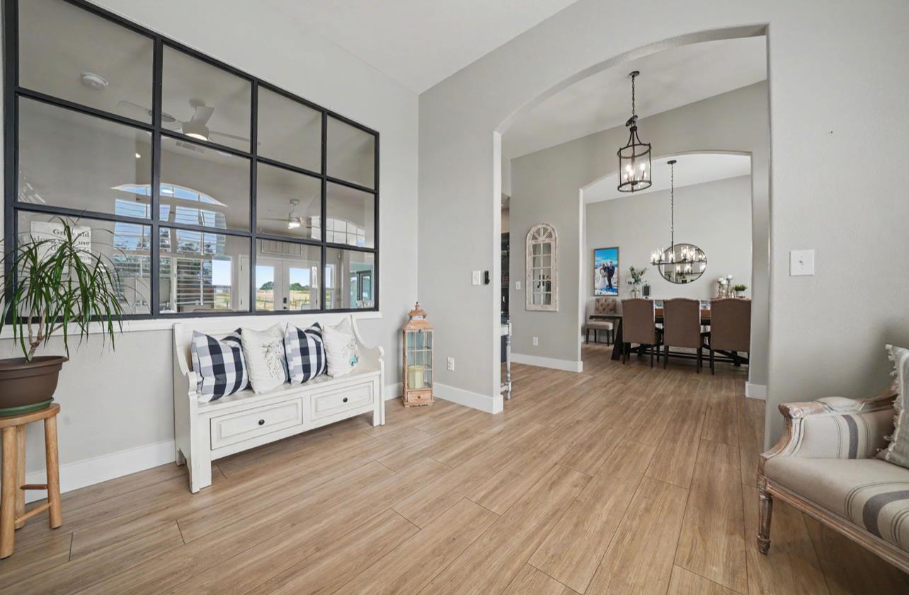 5600 Ferseyna Way Valley Springs, CA 95252 - Photo 49 of 94 a living room with furniture and a chandelier