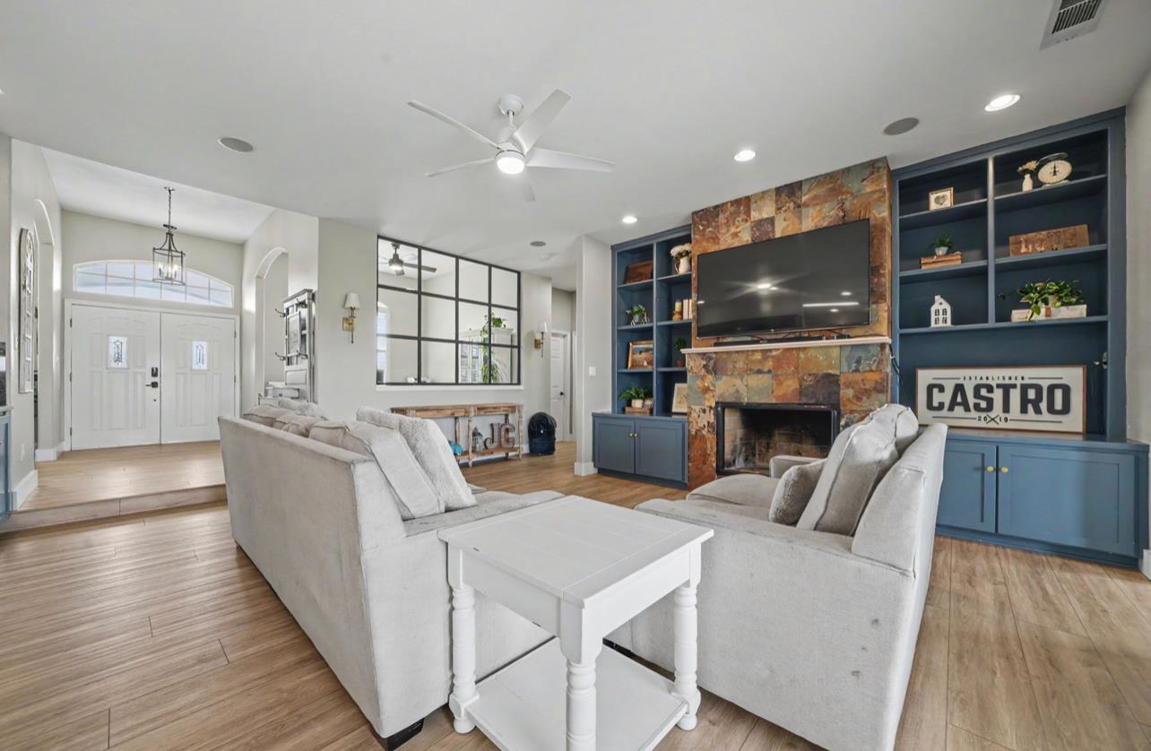 5600 Ferseyna Way Valley Springs, CA 95252 - Photo 53 of 94 a living room with furniture a flat screen tv and a fireplace