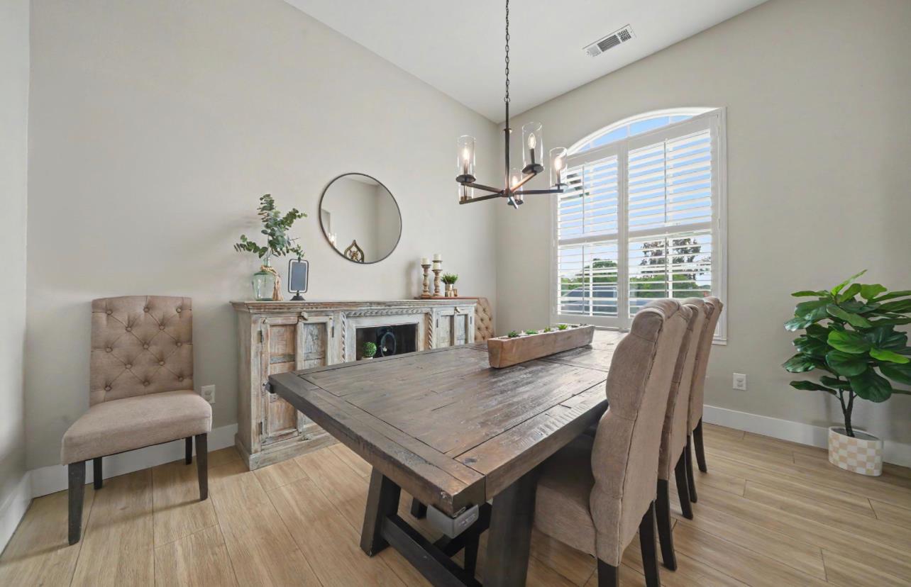 5600 Ferseyna Way Valley Springs, CA 95252 - Photo 61 of 94 a view of a dining room with furniture window and wooden floor