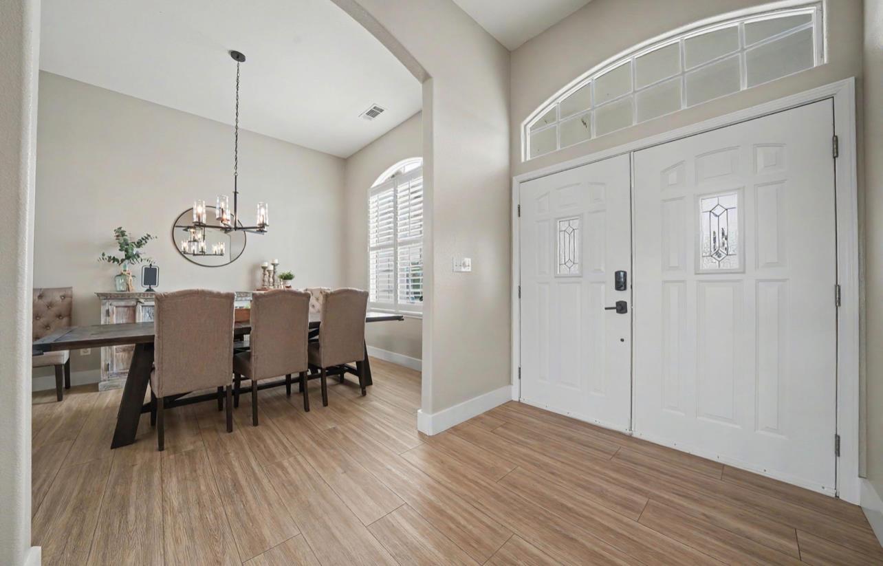 5600 Ferseyna Way Valley Springs, CA 95252 - Photo 62 of 94 a view of a dining room with furniture window and wooden floor