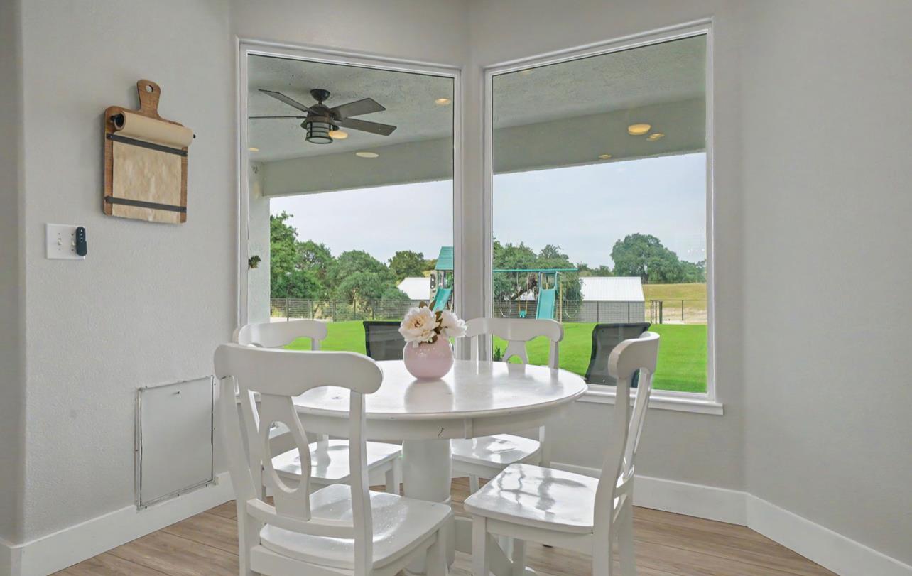 5600 Ferseyna Way Valley Springs, CA 95252 - Photo 63 of 94 a view of a dining room with furniture window and wooden floor
