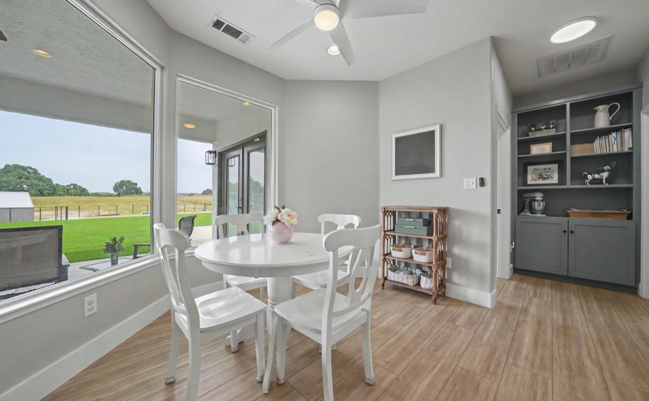 5600 Ferseyna Way Valley Springs, CA 95252 - Photo 64 of 94 a dining room with furniture and a floor to ceiling window