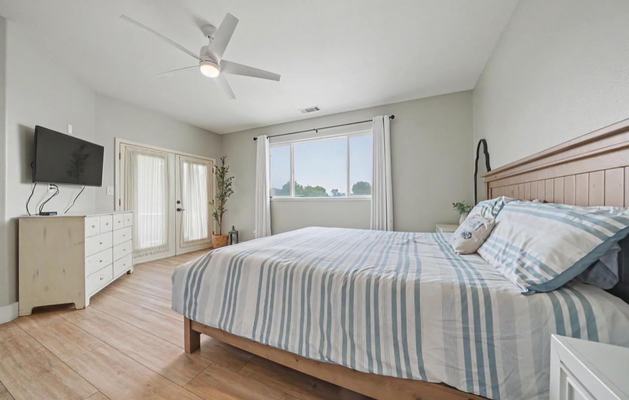 5600 Ferseyna Way Valley Springs, CA 95252 - Photo 68 of 94 a bedroom with a bed and a flat screen tv