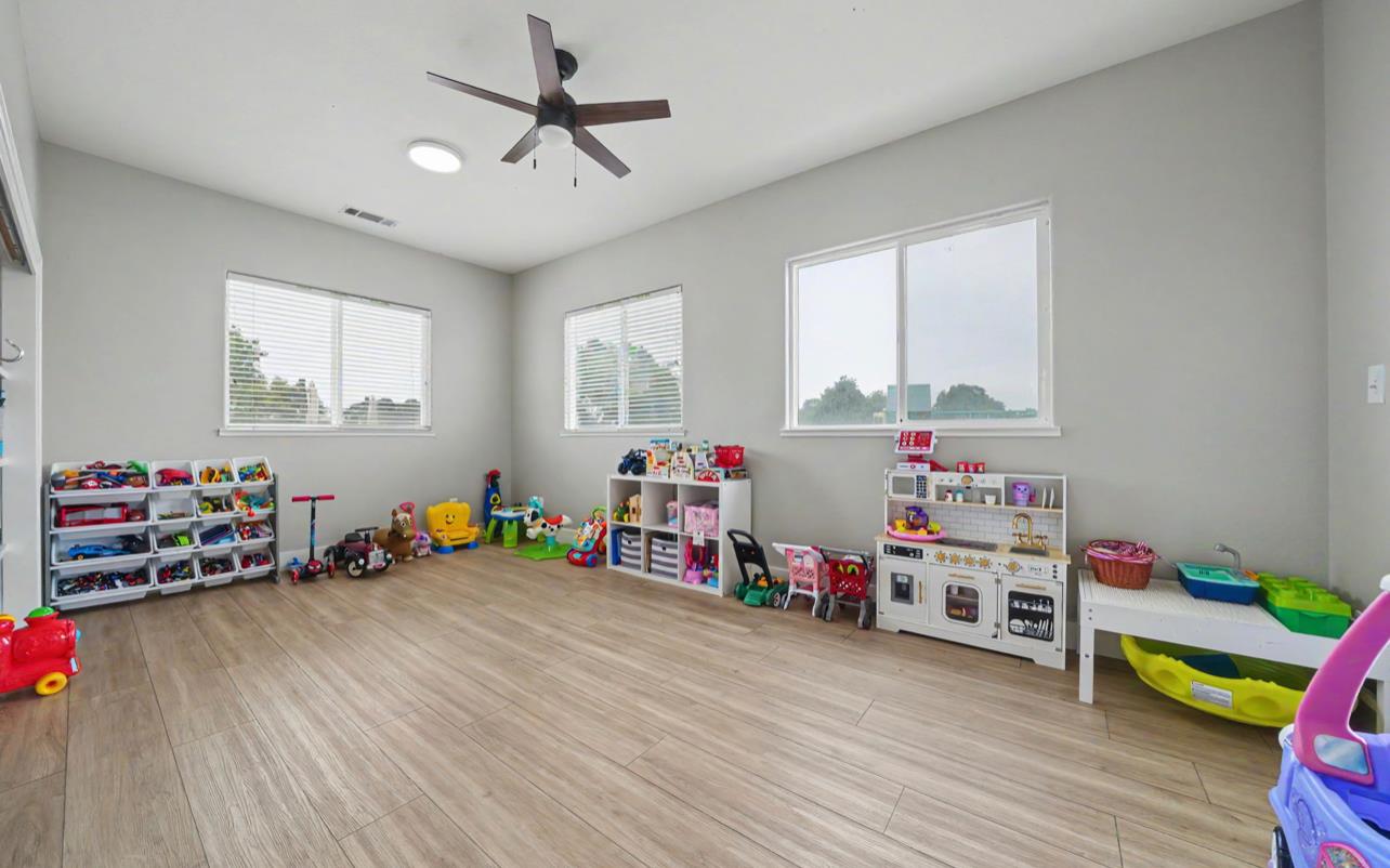 5600 Ferseyna Way Valley Springs, CA 95252 - Photo 70 of 94 a children room with toys and a wooden floor
