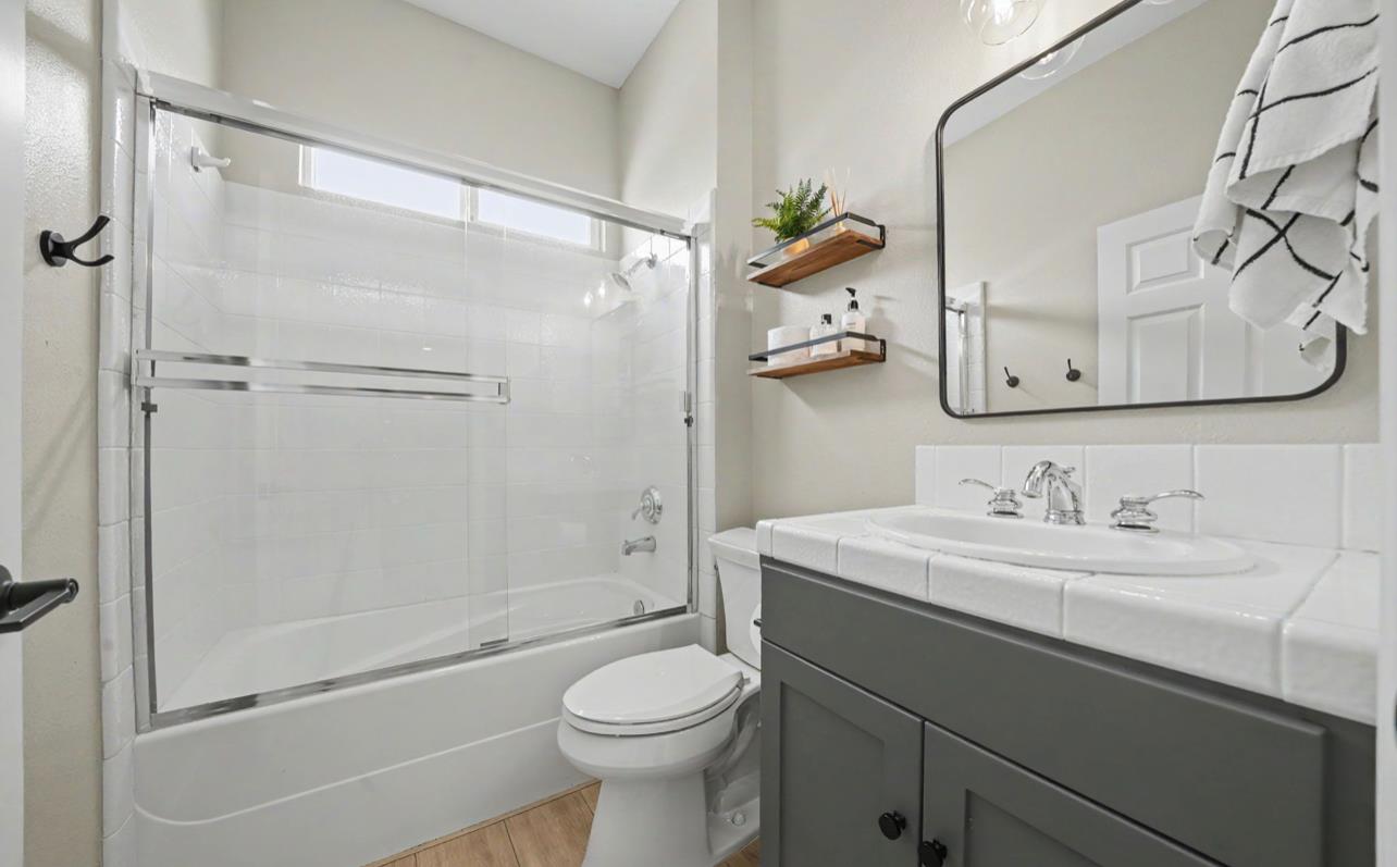 5600 Ferseyna Way Valley Springs, CA 95252 - Photo 76 of 94 a bathroom with a sink a toilet and shower