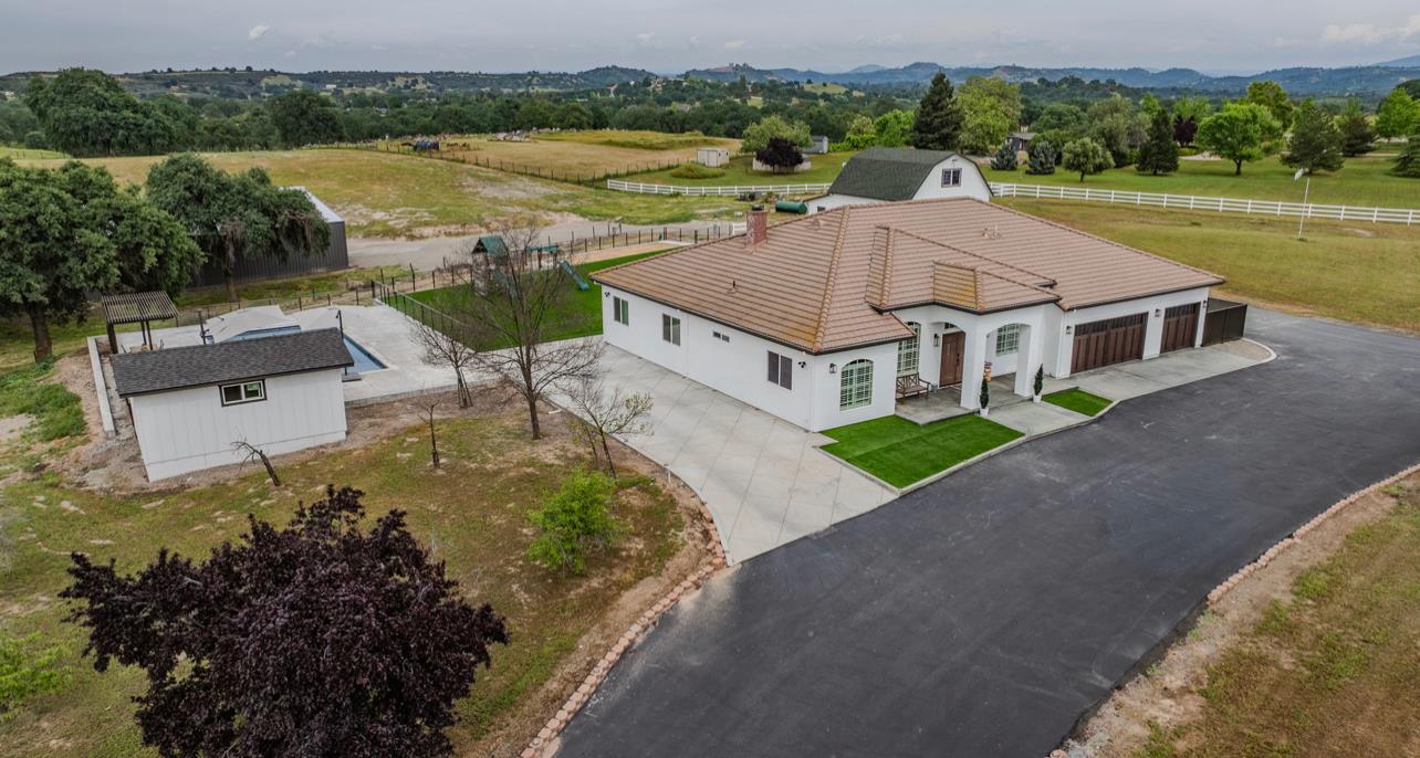 5600 Ferseyna Way Valley Springs, CA 95252 - Photo 82 of 94 an aerial view of a house with a garden and lake view