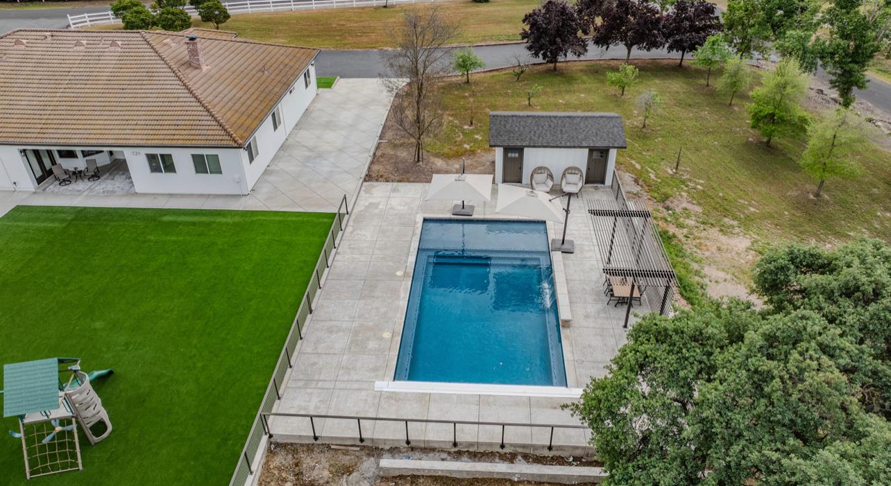 5600 Ferseyna Way Valley Springs, CA 95252 - Photo 86 of 94 an aerial view of a house with swimming pool and lake view