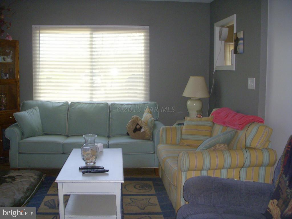 7674 Bethel Road Willards, MD 21874 - Photo 5 of 11 a living room with furniture and a window