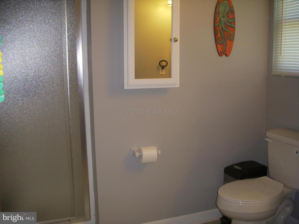 7674 Bethel Road Willards, MD 21874 - Photo 10 of 11 a bathroom with a toilet and a sink