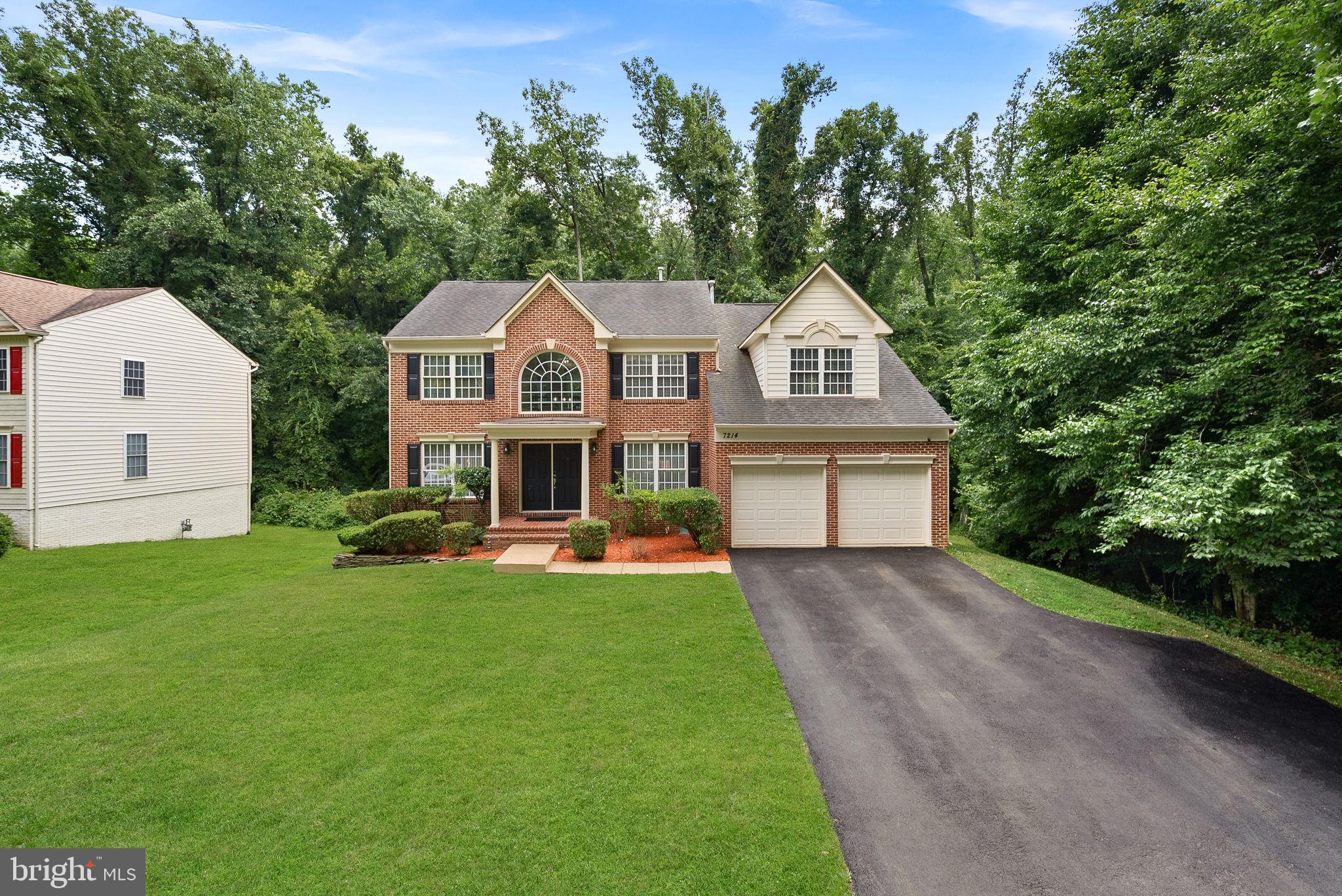 7214 Calamo Street Springfield, VA 22150 - Photo 1 of 77 Front exterior with spacious driveway