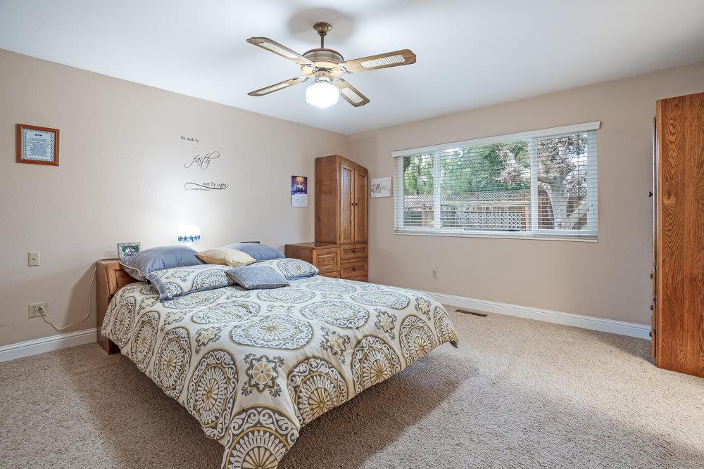 140 Rays Circle Hollister, CA 95023 - Photo 15 of 31 a bedroom with a bed and a large window