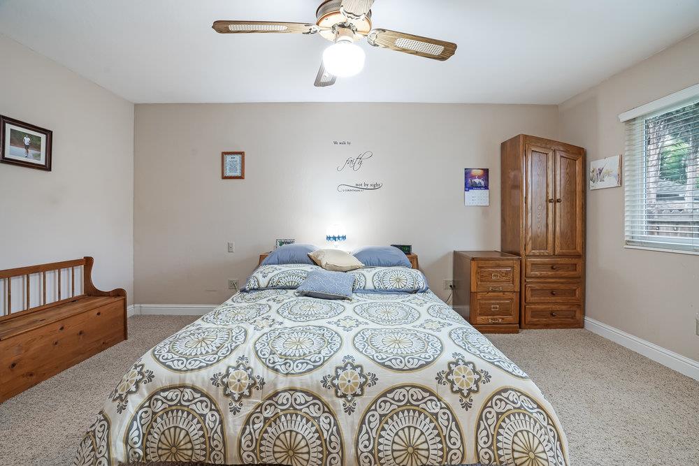 140 Rays Circle Hollister, CA 95023 - Photo 16 of 31 a bedroom with a bed and wooden floor