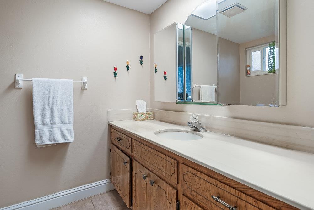 140 Rays Circle Hollister, CA 95023 - Photo 17 of 31 a bathroom with a sink and a mirror