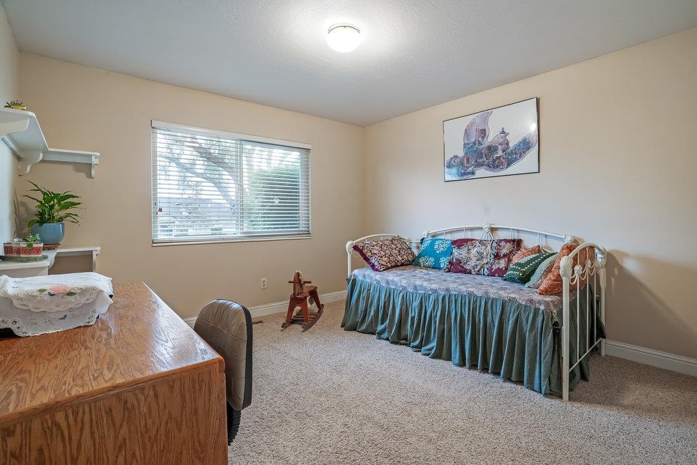 140 Rays Circle Hollister, CA 95023 - Photo 21 of 31 a bedroom with a bed and wooden floor