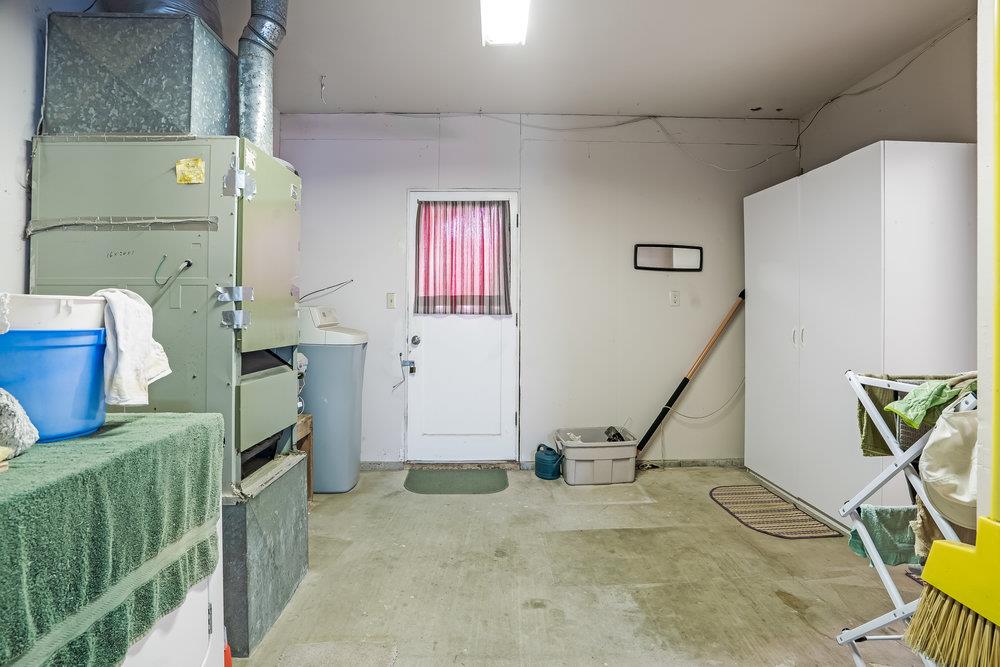 140 Rays Circle Hollister, CA 95023 - Photo 22 of 31 a view of a livingroom with furniture and a floor to ceiling window