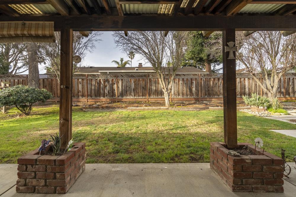 140 Rays Circle Hollister, CA 95023 - Photo 25 of 31 a view of a living room and floor to ceiling window