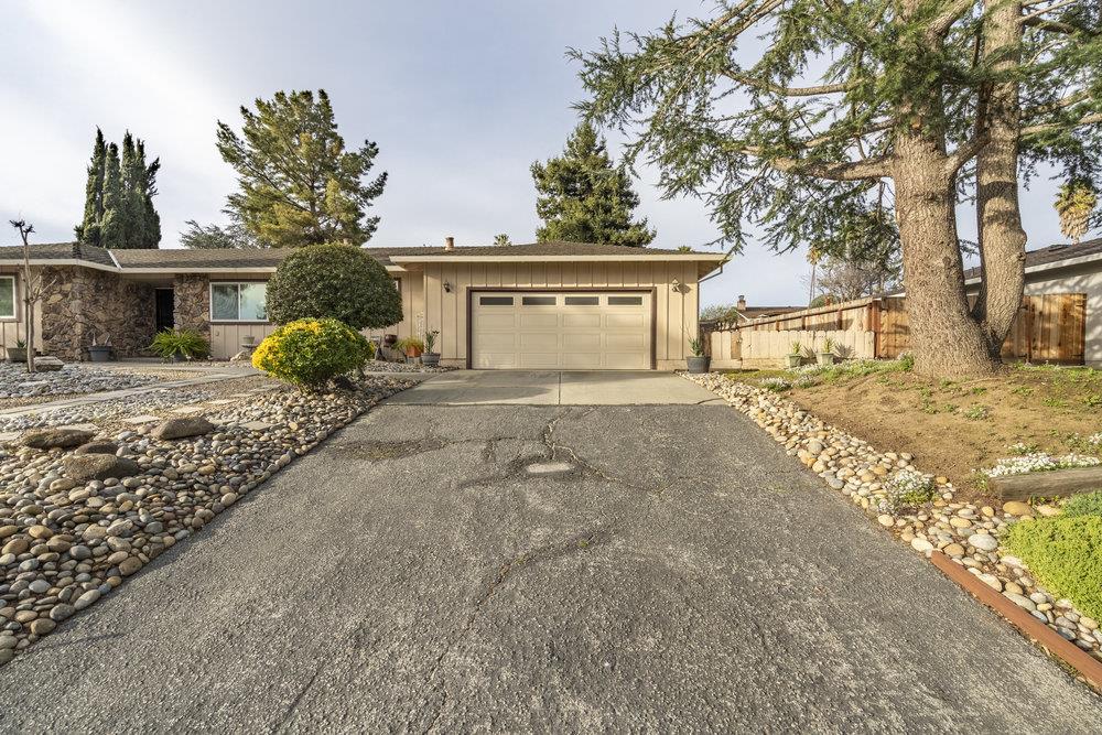 140 Rays Circle Hollister, CA 95023 - Photo 3 of 31 a front view of a house with a yard and garage