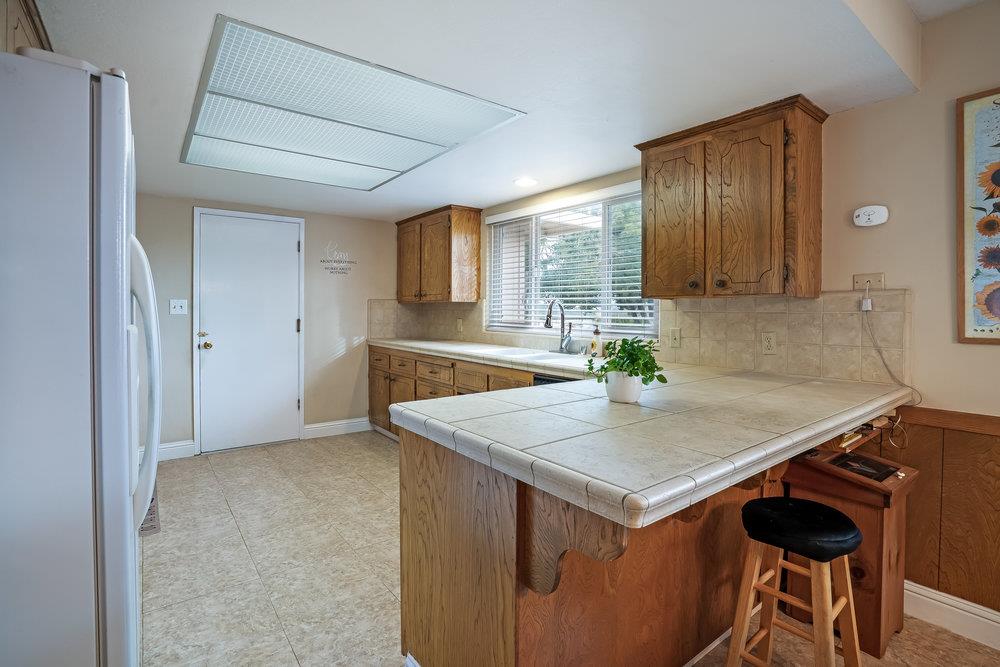 140 Rays Circle Hollister, CA 95023 - Photo 8 of 31 a view of kitchen island with wooden floor