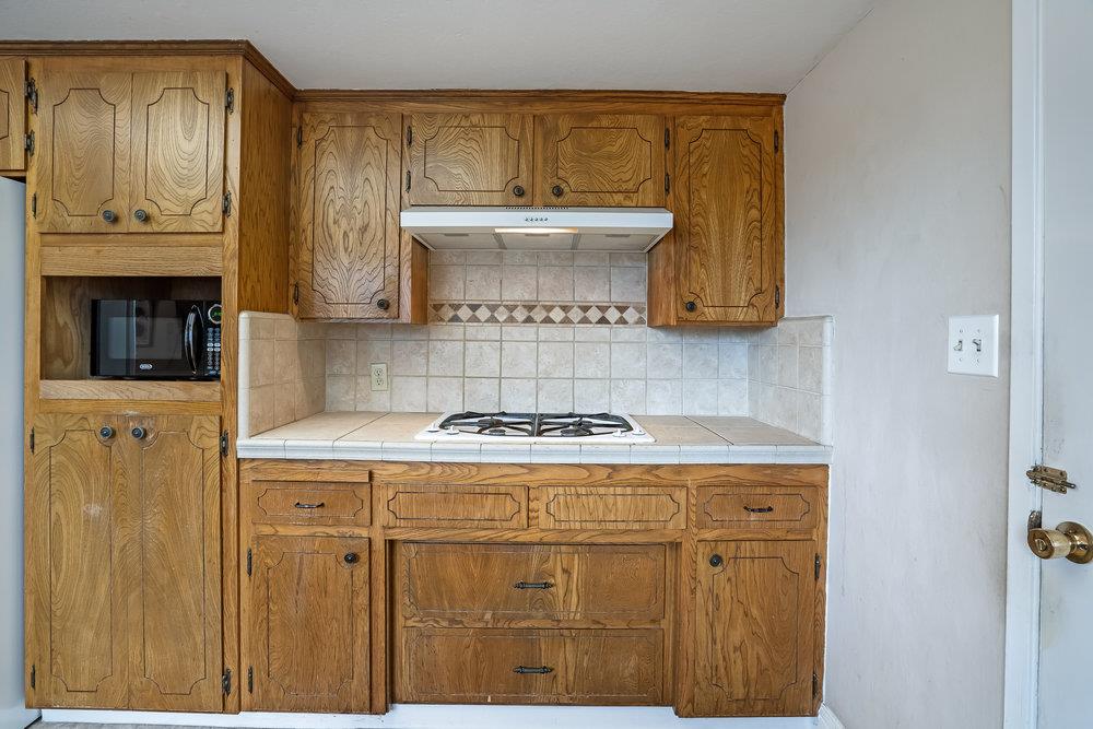 140 Rays Circle Hollister, CA 95023 - Photo 10 of 31 a kitchen with a stove and cabinets