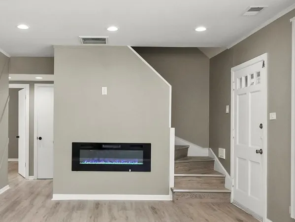 a view of a hallway with staircase