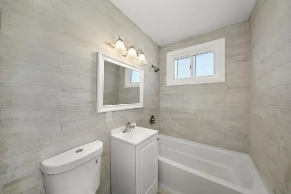 a bathroom with a sink toilet and bathtub