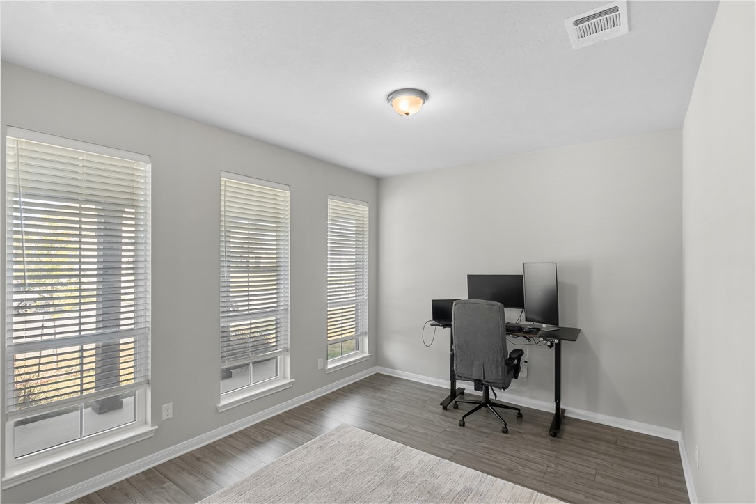1925 Viva Road Bryan, TX 77807 - Photo 12 of 25 Office area featuring baseboards and wood finished floors