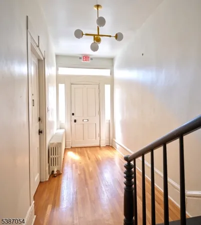 a view of entryway with wooden floor